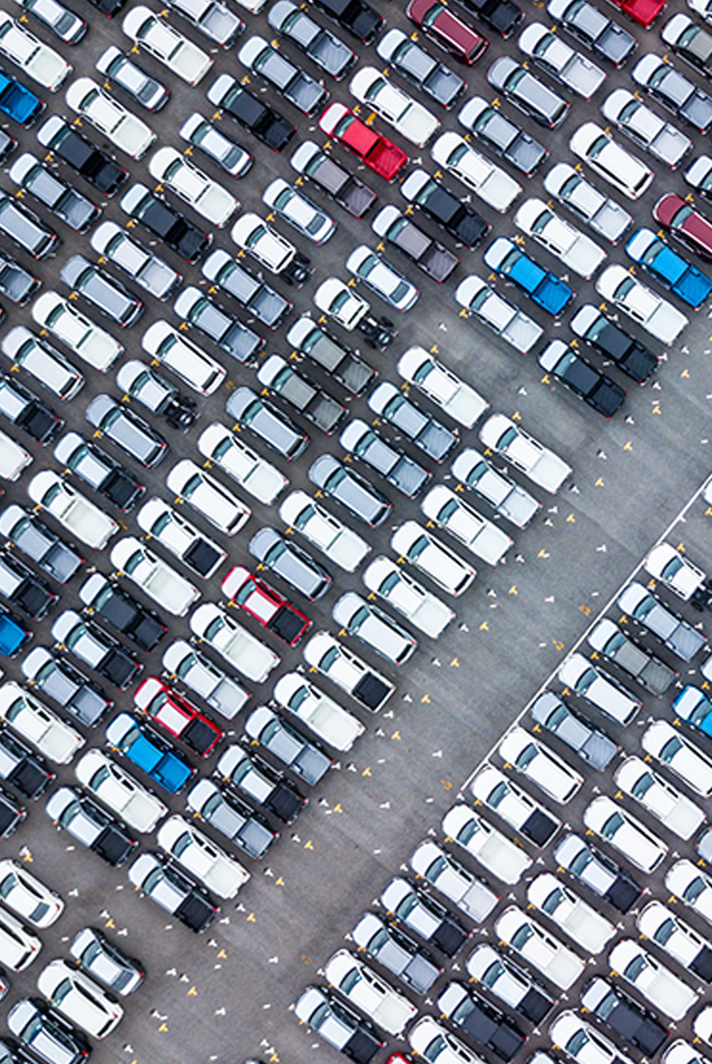 The image shows various parked cars in different colours, Symbolising Readywire’s solution for auto dealerships.